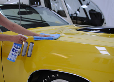 Man Cleaning Car with Waterless Wash & Wax